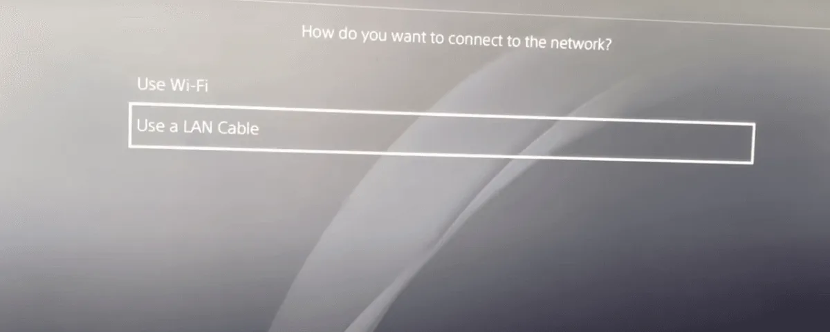 PS4 screen asking how to connect to the network with Use Wi-Fi and Use a LAN Cable options